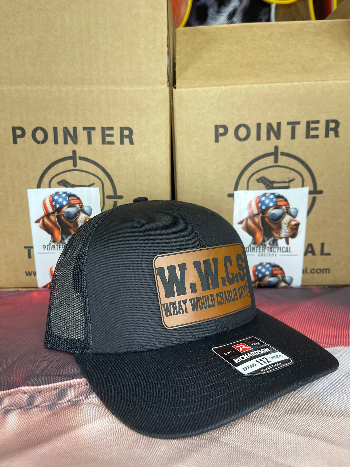 W.W.C.S. – What Would Charlie Say? Leather Patch Trucker Hat (Richardson 112)