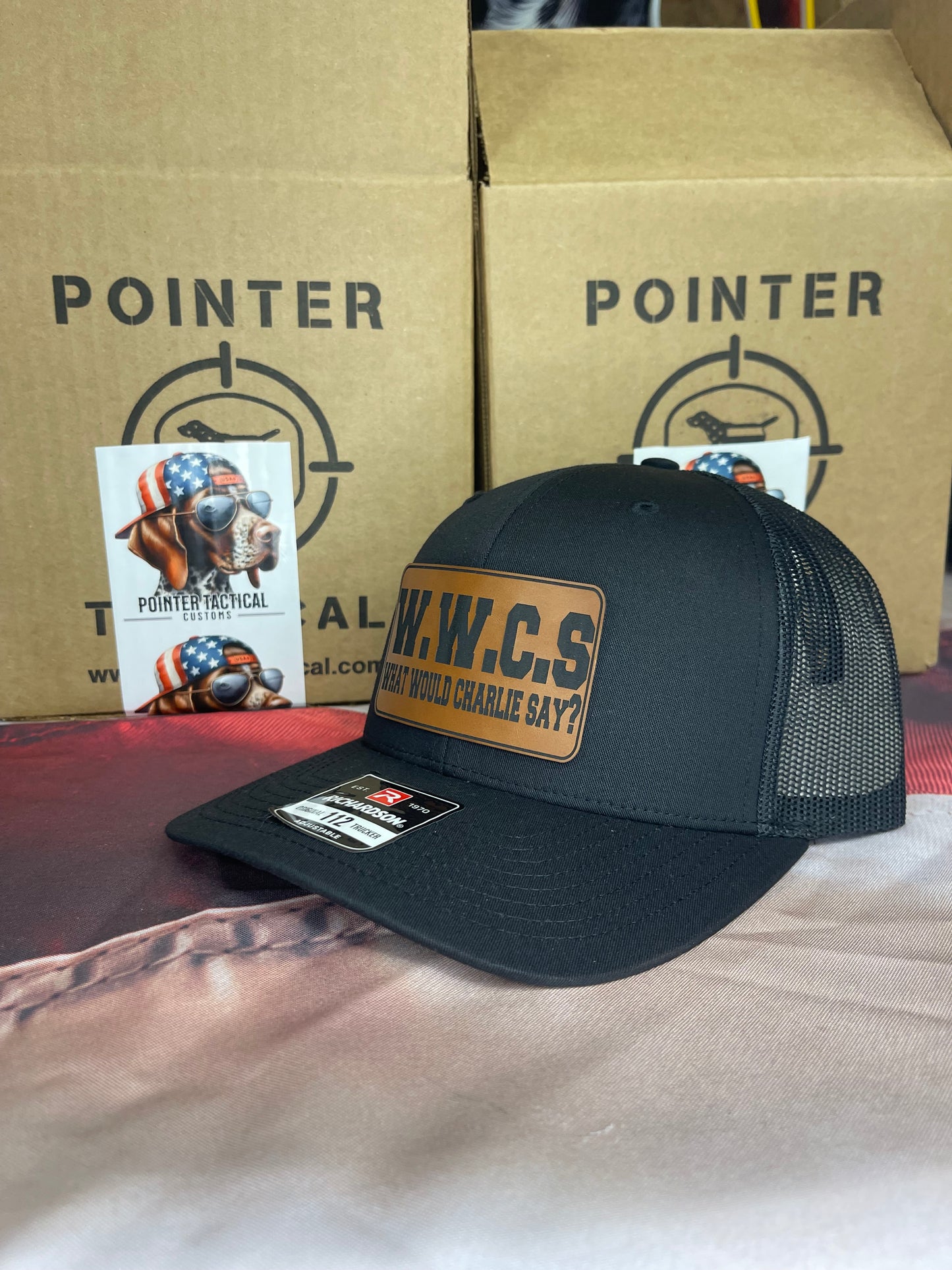 W.W.C.S. – What Would Charlie Say? Leather Patch Trucker Hat (Richardson 112)