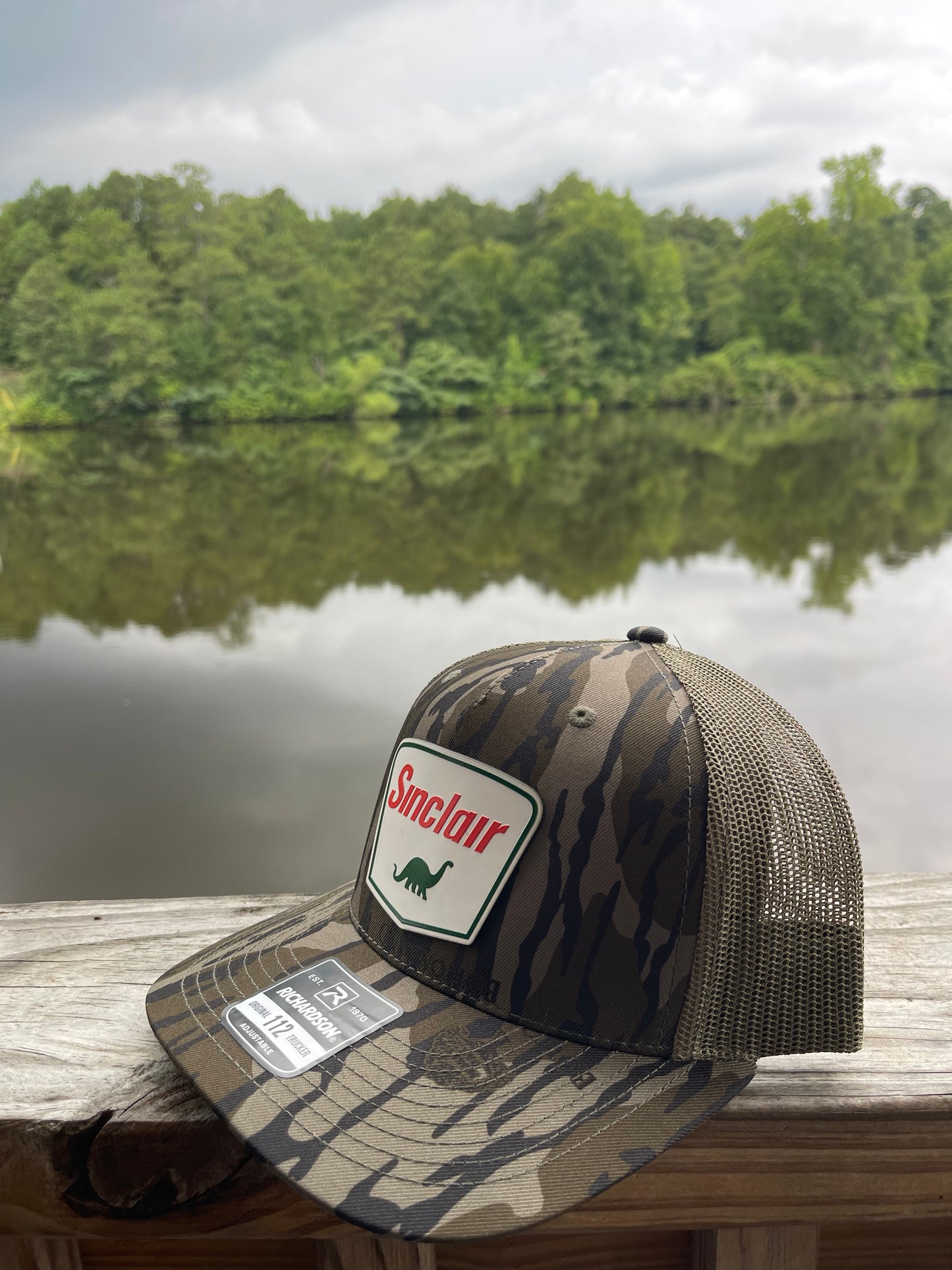 Sinclair Bottomland Camo Trucker Hat
